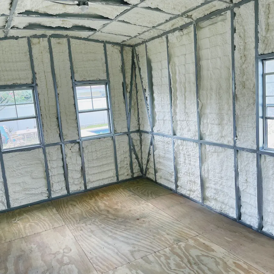 Closed-cell spray foam insulation applied to wall cavities in a residential project in Gilmer